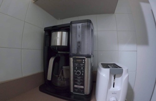 Guanajibo Apartment | Beachfront Apartment in Joyuda With Pool and Basketball Court
