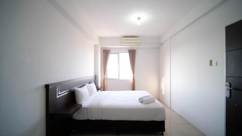 Simple 2BR with Extra Bed at Menara Rungkut Apartment By Travelio in Surabaya