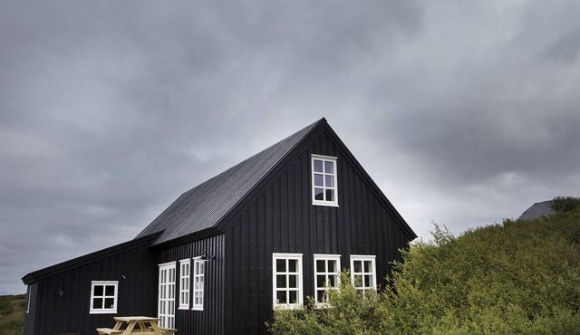 Traditional timber house by the sea in Borgarnes