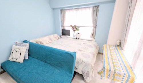 One-Bedroom Apartment with Balcony and City View