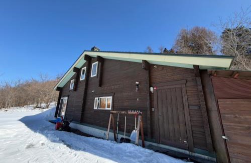 Toyoura Apartment | large log cabin 桜