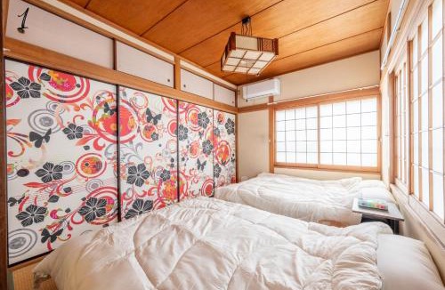Shin-Osaka Apartment | 7BR Entire 2-House Rental Sleeps 12 Theater and Games Umeda 3 Min